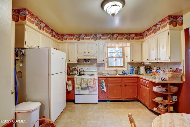 7 N Red Maple St, Selinsgrove, PA 17870 - kitchen featuring white appliances, under cabinet range hood, tasteful backsplash, and light countertops