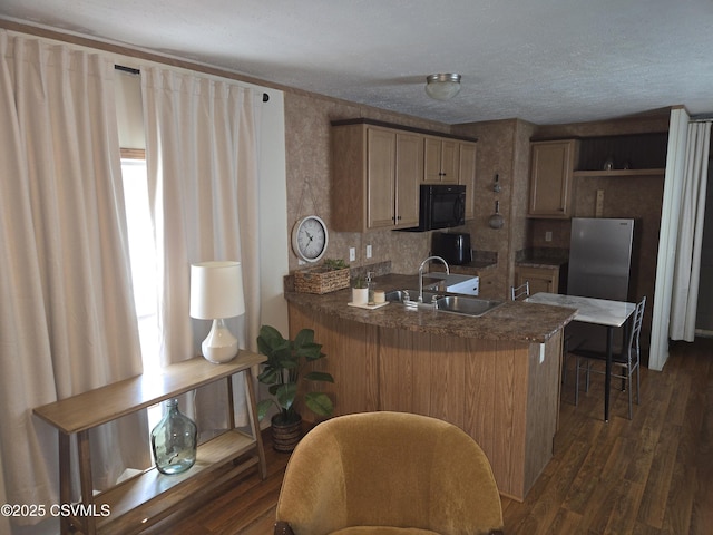 94 Porter Gray Rdg, Bloomsburg, PA 17815 - kitchen with black microwave, a peninsula, dark wood-style flooring, a breakfast bar area, and open shelves