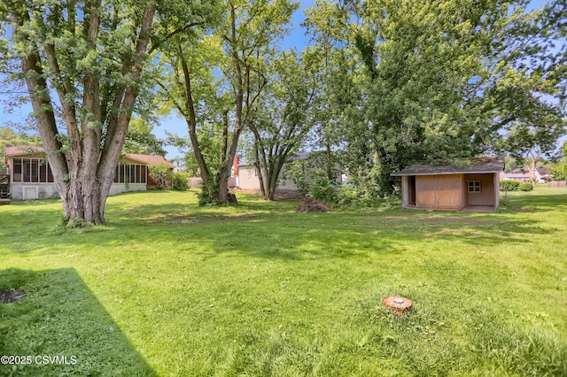 152 Bridge Ave, Allenwood, PA 17810 - view of grassy yard featuring a shed and a sunroom