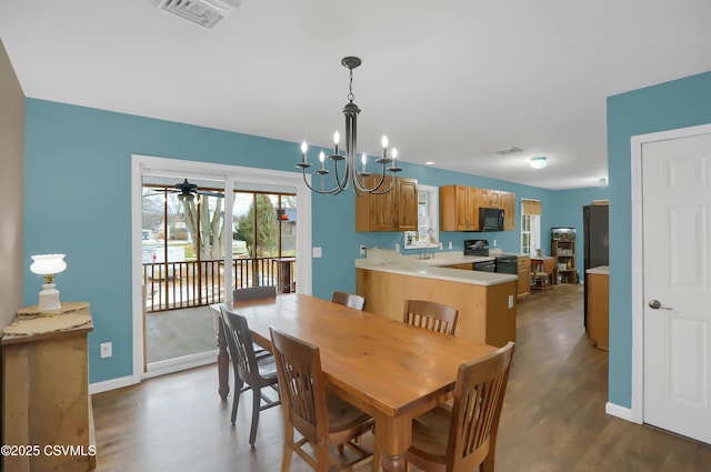 152 Bridge Ave, Allenwood, PA 17810 - dining room featuring wood finished floors, a ceiling fan, and a chandelier