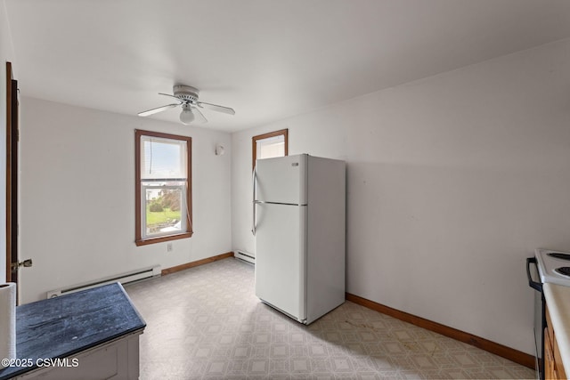 109 W Ninth St, Watsontown, PA 17777 - kitchen featuring white appliances, baseboard heating, a ceiling fan, and light flooring