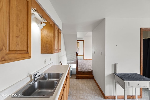 109 W Ninth St, Watsontown, PA 17777 - kitchen featuring light flooring, light countertops, and brown cabinetry
