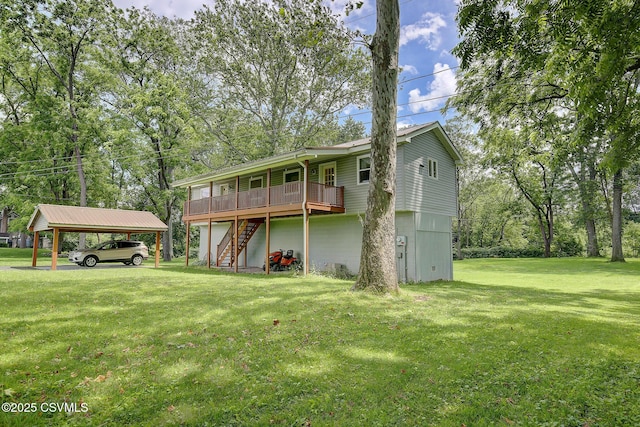 108 Creek Rd, Selinsgrove, PA 17870 - back of property featuring stairway, a detached carport, a lawn, and a wooden deck