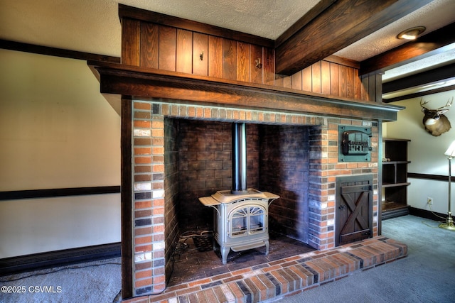 157 Distillery Hill Rd, Benton, PA 17814 - detailed view of beamed ceiling, carpet flooring, a wood stove, a textured ceiling, and wood walls