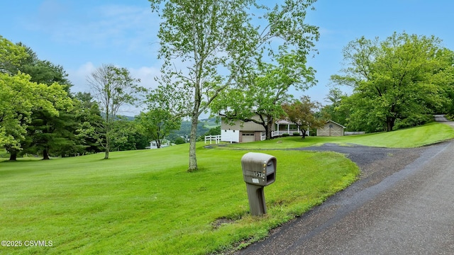 157 Distillery Hill Rd, Benton, PA 17814 - view of front of property with a front lawn, a garage, driveway, and view of scattered trees