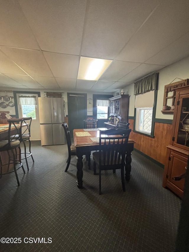 1211 W Mulberry St, Coal Township, PA 17866 - dining area with carpet floors, a drop ceiling, wainscoting, and wooden walls