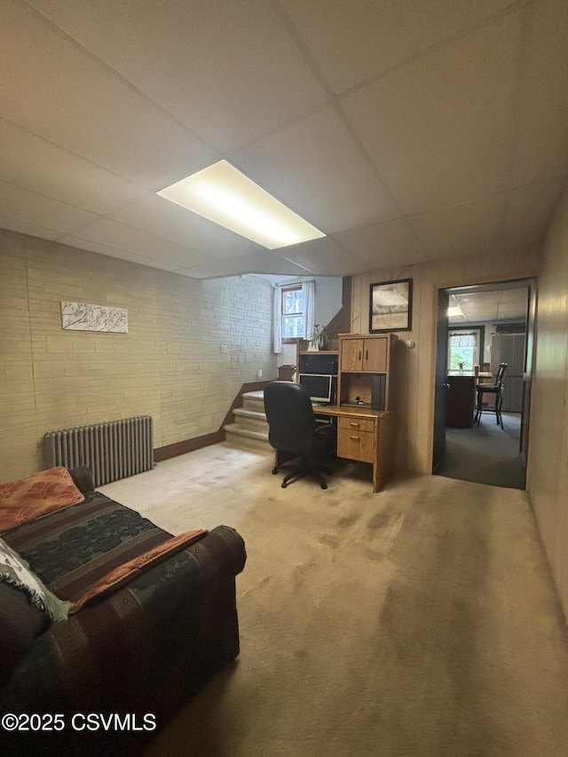 1211 W Mulberry St, Coal Township, PA 17866 - office area with radiator heating unit, light colored carpet, healthy amount of natural light, and brick wall