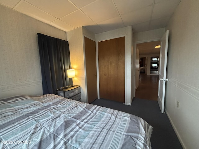 1211 W Mulberry St, Coal Township, PA 17866 - bedroom with wallpapered walls, a paneled ceiling, a closet, and dark colored carpet