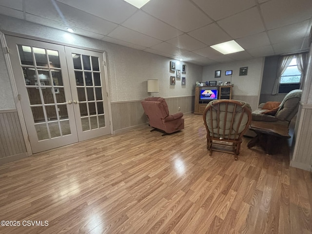 1211 W Mulberry St, Coal Township, PA 17866 - living room with a wainscoted wall, wood finished floors, french doors, and a paneled ceiling