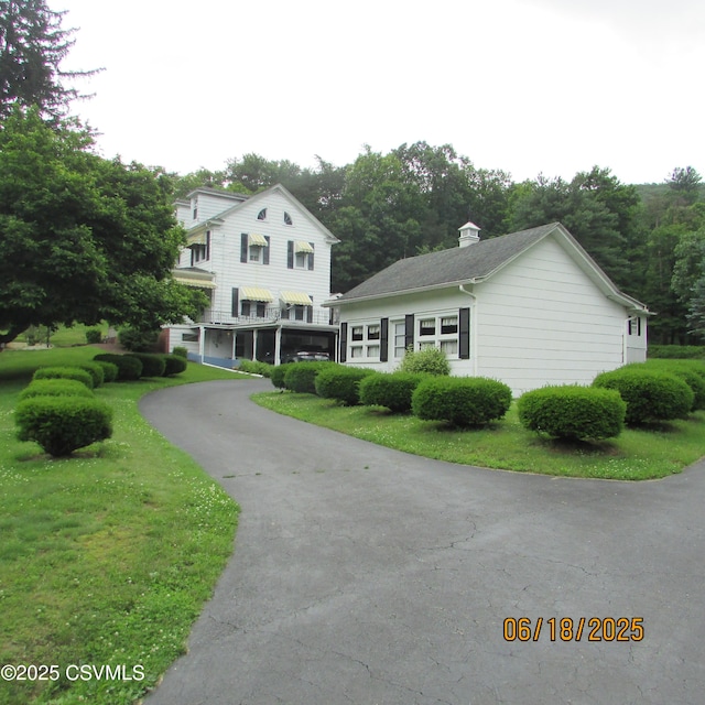 324 Tulip Rd, Paxinos, PA 17860 - traditional-style home featuring driveway and a front lawn