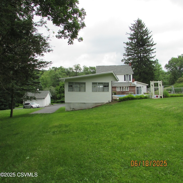 324 Tulip Rd, Paxinos, PA 17860 - view of front facade featuring an outdoor structure, a front yard, and a chimney