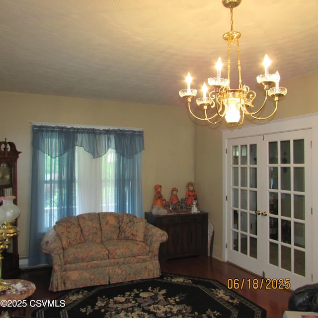 324 Tulip Rd, Paxinos, PA 17860 - living room featuring a chandelier, wood finished floors, and french doors