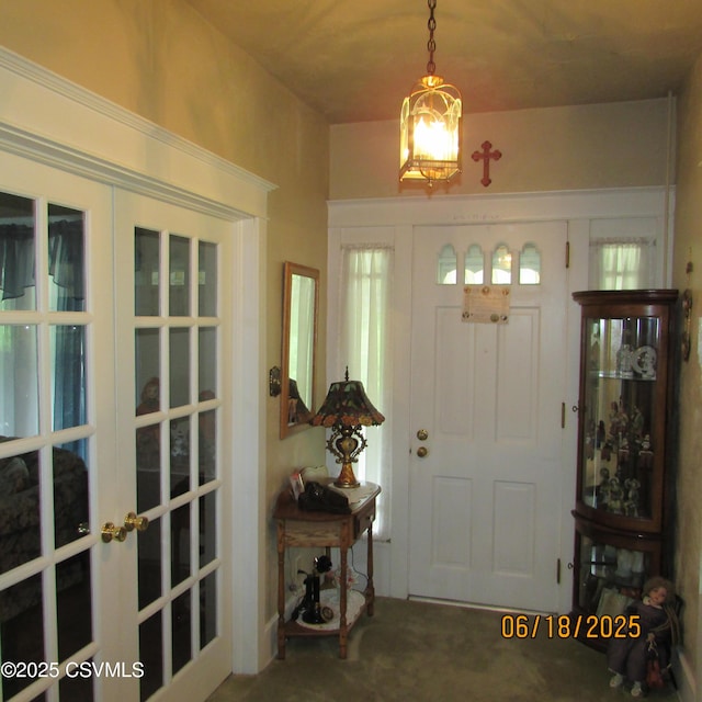 324 Tulip Rd, Paxinos, PA 17860 - carpeted entrance foyer with french doors and a chandelier