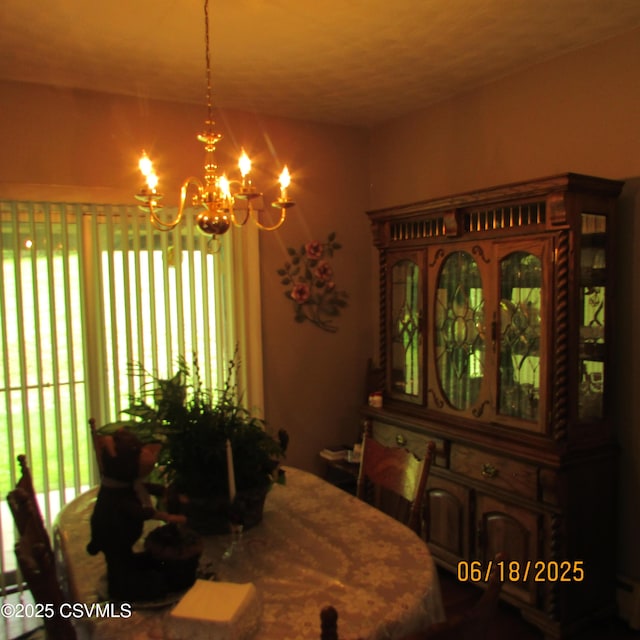 324 Tulip Rd, Paxinos, PA 17860 - dining room featuring a chandelier, a baseboard radiator, and healthy amount of natural light