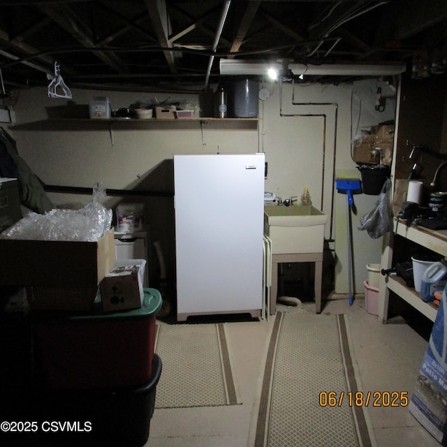 324 Tulip Rd, Paxinos, PA 17860 - unfinished basement featuring freestanding refrigerator and a sink
