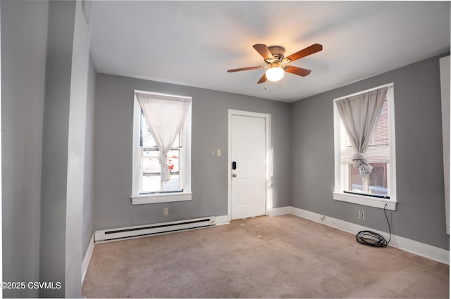 126-128 Murray Ave, Bloomsburg, PA 17815 - spare room featuring a baseboard heating unit, ceiling fan, and carpet flooring