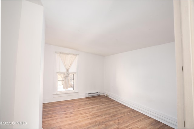 126-128 Murray Ave, Bloomsburg, PA 17815 - unfurnished room featuring a baseboard heating unit and light wood-style flooring