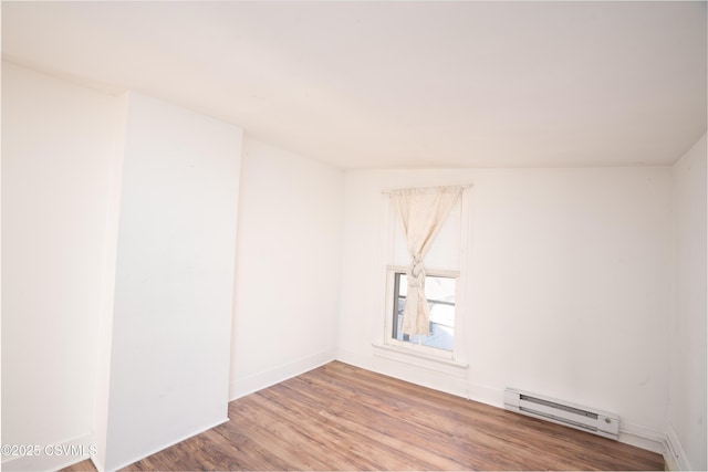 126-128 Murray Ave, Bloomsburg, PA 17815 - unfurnished room featuring baseboard heating and wood finished floors