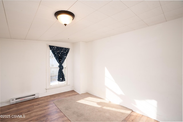 126-128 Murray Ave, Bloomsburg, PA 17815 - unfurnished room featuring a baseboard heating unit and wood finished floors