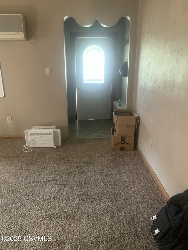 1542 1st Ave, Berwick, PA 18603 - spare room featuring a wall unit AC, carpet, and a wall mounted air conditioner