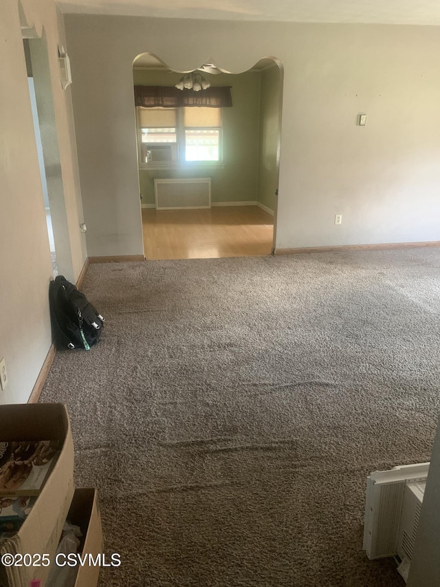 1542 1st Ave, Berwick, PA 18603 - carpeted spare room featuring radiator heating unit and arched walkways
