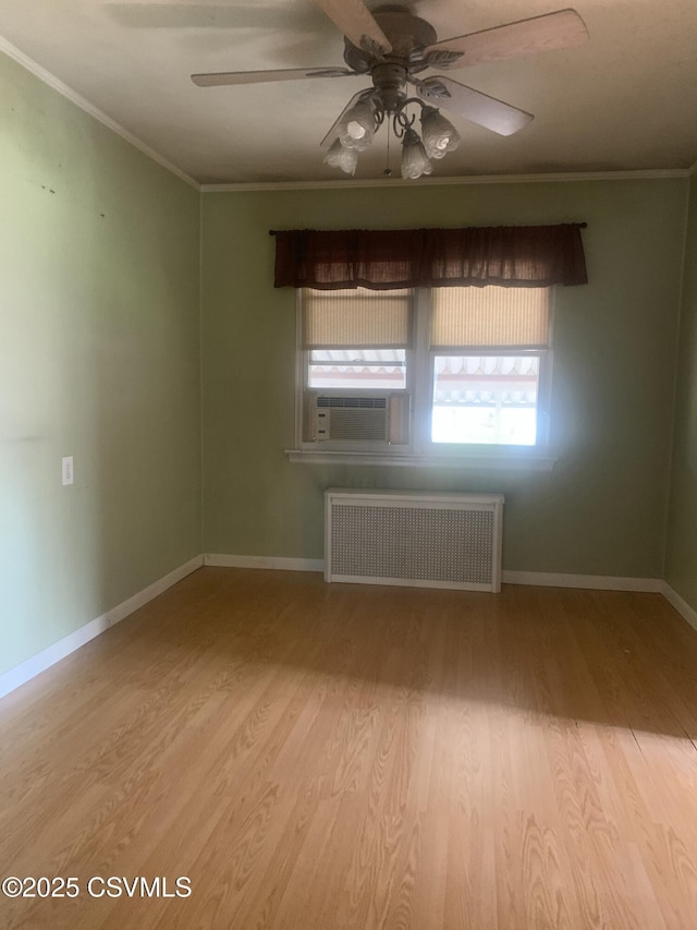 1542 1st Ave, Berwick, PA 18603 - unfurnished room with radiator heating unit, ornamental molding, cooling unit, wood finished floors, and ceiling fan