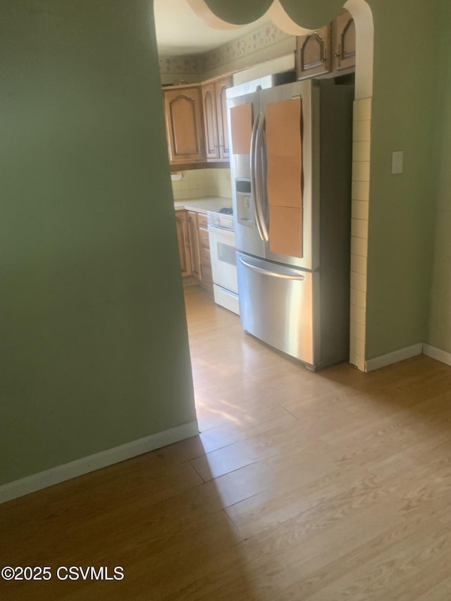 1542 1st Ave, Berwick, PA 18603 - kitchen with stainless steel fridge with ice dispenser, white gas range oven, light wood-type flooring, and light countertops