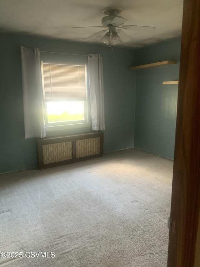 1542 1st Ave, Berwick, PA 18603 - spare room with radiator, ceiling fan, and carpet floors