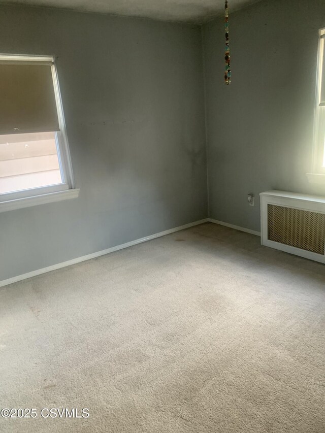1542 1st Ave, Berwick, PA 18603 - carpeted spare room with radiator and baseboards