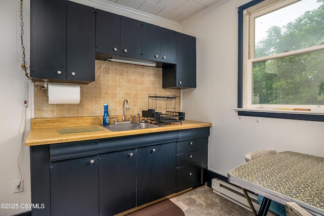 846-848 Orange St, Berwick, PA 18603 - kitchen featuring light countertops, crown molding, backsplash, and blue cabinets
