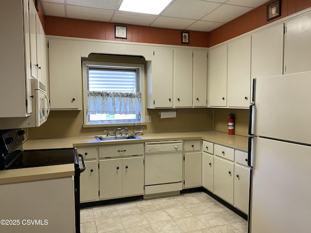 846-848 Orange St, Berwick, PA 18603 - kitchen featuring white appliances, light countertops, and a paneled ceiling