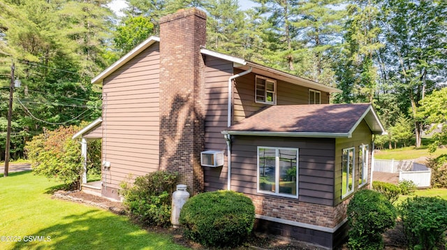39 Mckendree Rd, Shickshinny, PA 18655 - view of property exterior with a chimney, a lawn, and roof with shingles