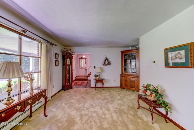 39 Mckendree Rd, Shickshinny, PA 18655 - living area featuring a baseboard radiator, stairway, and light colored carpet