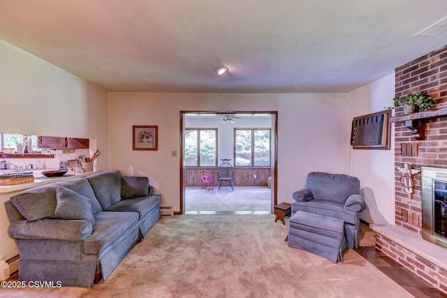 39 Mckendree Rd, Shickshinny, PA 18655 - carpeted living area featuring a fireplace, a baseboard heating unit, a wall mounted AC, and a ceiling fan