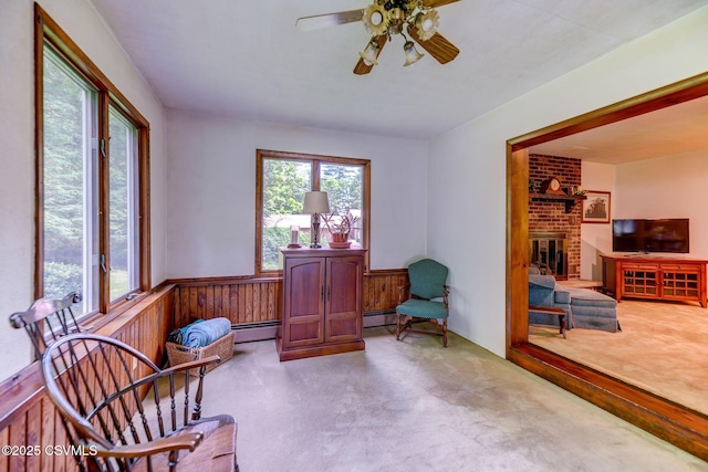 39 Mckendree Rd, Shickshinny, PA 18655 - sitting room with carpet floors, wainscoting, baseboard heating, ceiling fan, and a fireplace