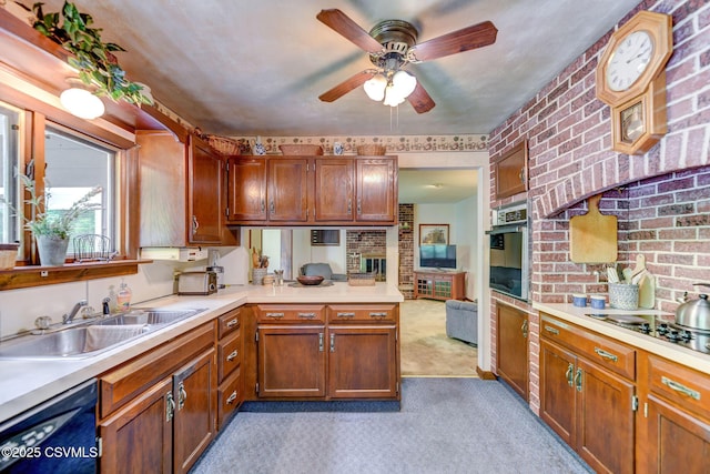 39 Mckendree Rd, Shickshinny, PA 18655 - kitchen with black appliances, light countertops, light colored carpet, ceiling fan, and a peninsula