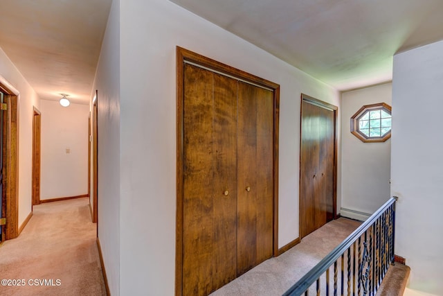 39 Mckendree Rd, Shickshinny, PA 18655 - hall featuring light carpet, baseboard heating, and an upstairs landing