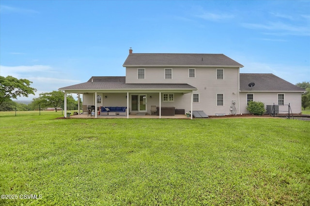 110 Buckeye Ln, New Columbia, PA 17856 - back of house with an outdoor living space, a lawn, a patio, and a chimney