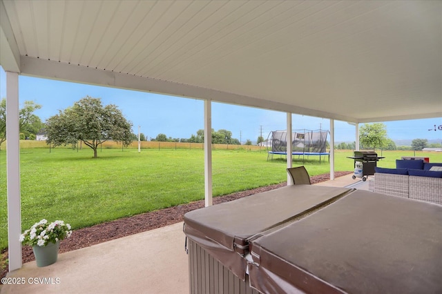 110 Buckeye Ln, New Columbia, PA 17856 - view of patio with a hot tub, a trampoline, and grilling area