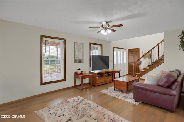 110 Buckeye Ln, New Columbia, PA 17856 - living area with wood finished floors, ceiling fan, and stairway