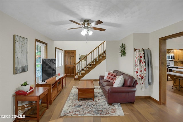 110 Buckeye Ln, New Columbia, PA 17856 - living room with stairs, light wood-type flooring, and ceiling fan