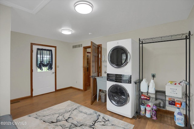 110 Buckeye Ln, New Columbia, PA 17856 - washroom with stacked washer and clothes dryer and wood finished floors