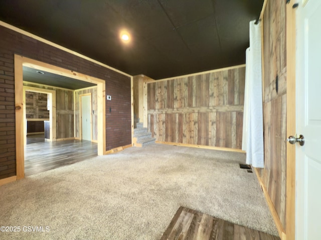 333 E Bowman St, Berwick, PA 18603 - carpeted spare room featuring stairs and brick wall