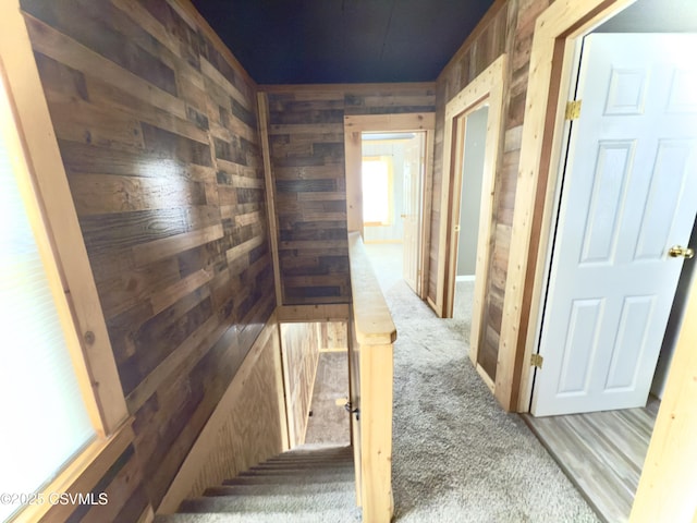 333 E Bowman St, Berwick, PA 18603 - hall with wooden walls, carpet floors, and an upstairs landing