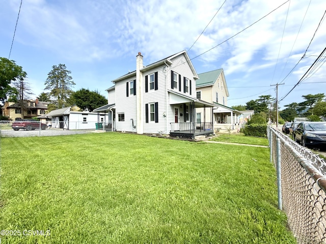 333 E Bowman St, Berwick, PA 18603 - back of house featuring a chimney, covered porch, and a fenced backyard