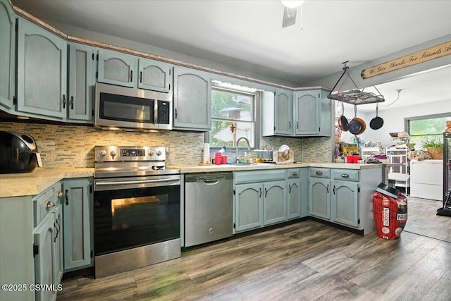 1146 Great Oak Dr, East Stroudsburg, PA 18301 - kitchen featuring stainless steel appliances, light countertops, dark wood-style flooring, and backsplash