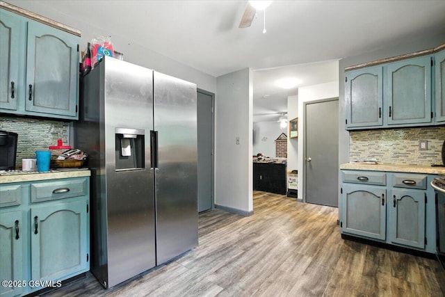 1146 Great Oak Dr, East Stroudsburg, PA 18301 - kitchen featuring stainless steel fridge, light countertops, backsplash, and wood finished floors