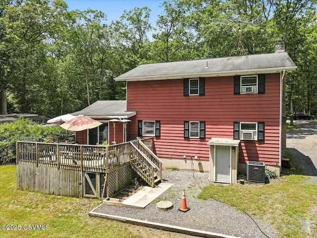 1146 Great Oak Dr, East Stroudsburg, PA 18301 - rear view of house with a wooden deck, a chimney, and a yard