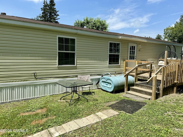 57 Buckhorn Rd, Bloomsburg, PA 17815 - rear view of house featuring a deck and a lawn