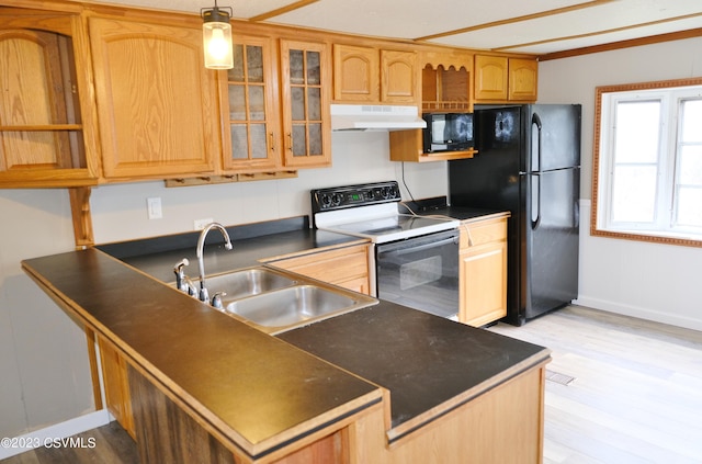 1824 Smalsh Barrick Rd, Middleburg, PA 17842 - kitchen featuring black appliances, under cabinet range hood, dark countertops, light wood finished floors, and glass insert cabinets